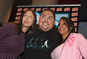 187-SBCF10-6585 - South Beach Comedy Festival comedian Gabriel Iglesias poses with some of the hundreds of fans he spent several hours with greeting them all personally at The Fillmore Miami Beach