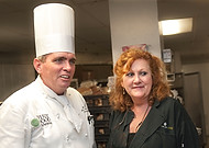 FIU0087-WF10 Chef Michael Moran helps celebrity chef Laura Schmalhorst of Tampa