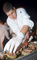 FIU-BubbleQ-8614 - FIU School of Hospitality student Ryan Egozi prepares food at the BubbleQ event of the 2008 South Beach Wine and Food Festival in Miami Beach.