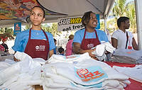FIU-Grd-Taste-9156 - FIU School of Hospitality students help to pass out items at the KidZ Kitchen Saturday morning at the 2008 South Beach Wine and Food Festival in Miami Beach.