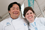 FIU-0464-WF104200 - Celebrity Chef Ming Tsai with FIU School of Hospitality student at the Grand Tasting Village at the 2010 South Beach Wine & Food Festival