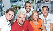 FIU-GrandTasting-0291 - FIU School of Hospitality Students, (in white from left), Amber Maxwell, Alex Vizcain, Angela Edwards with Food Network Chefs and Culinary Personalitys Guy Fieri and Cat Cora in the Grand Tasting Village at the 2008 South Beach Wine and Food Festival in Miami Beach.