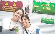 FIU-GrandTasting-9864 - FIU School of Hospitality students Andre Munoz and Francine Bigio inside the FIU student checkin tent of the 2008 South Beach Wine and Food Festival in Miami Beach.