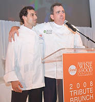 FIU-Tribute-0150a - FIU School of Hospitality Professor Chef Michael Moran,right, speaks to the Tribute Lunch audience about FIU School of Hospitality Student Chef of the Year Michael Cremeno. (Photo by Mitchell Zachs / FIU School of Hospitality)