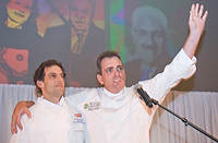 FIU-Tribute-0152 - FIU School of Hospitality Professor Chef Michael Moran, right, waves to the Tribute Lunch audience as FIU School of Hospitality student and winner of the Barilla Best New Student Chef Award for 2008 Michael Cremeno accepted the award (Photo by Michell Zachs/FIU School of Hospitality)