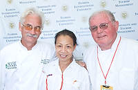 FIU-Grd-Taste-0310 - Professor Chef Roger Probst, Helen Lo and Profesor Kevin Robson  in the Grand Tasting Village at the 2008 South Beach Wine and Food Festival in Miami Beach.