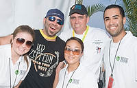 FIU-Grd-Taste-0327 - Food Network Chef and Culinary Personality Duff and Professor Chef Michael Moran with (from front left), FIU School of Hospitality Students Amber Maxwell, Angela Edwards and Alex Vizcain in the Grand Tasting Village at the 2008 South Beach Wine and Food Festival in Miami Beach.