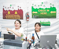 FIU-Grd-Taste-9863 - FIU School of Hospitality students Andre Munoz and Francine Bigio help to check in some of the over 500 FIU School of Hospitality students who participated at the 2008 South Beach Wine and Food Festival in Miami Beach.