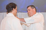 FIU-Tribute-0145 - FIU School of Hospitality Professor Chef Michael Moran, right, presents a new chefs jacket to with FIU School of Hospitality student and winner of the Barilla Best New Student Chef Award for 2008 Michael Cremeno. (Photo by Michell Zachs/FIU School of Hospitality)