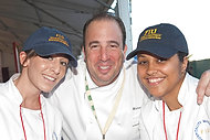 FIU-WF09-022225 - Chef Michael Schlow of Radius in Boston Mass with FIU School of Hospitality students Amy Bendik, left, and Jennifer Almonte at the Burger Bash.