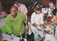 FIU-WF09-033088 - Al Roker with FIU School of Hospitality student Pamela Buque and other assistant students at the Bubble Q.