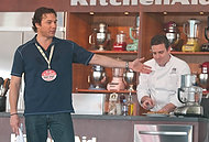 FIU-WF09-033133 - Cooking Personality Rocco DiSpirito gives a cooking demonstration assisted by FIU School of Hospitality student Kevin Purdy at the Grand Tasting Village.