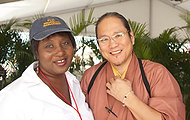 FIU-WF09-033854 - Chef Masaharu Morimoto, right, is among hundreds of chefs gathered together for Florida International University School of Hospitality's annual fundraiser South Beach Wine and Food Festival to raise money for student scholarships Saturday, February, 21, 2009 at the Grand Tasting Village of the SBWF in Miami Beach, Fl. At left is FIU student chef Alicia Green who assisted celebrity chefs near the stage.