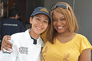 FIU-WF09-033896 - FIU School of Hospitality student Stephanie Yeung, left, and Food Network Personality Sunny Anderson at the Grand Tasting Village.