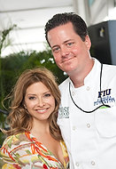 FIU-WF09-033919 - Food Network's Ingrid Hoffman, left, is among hundreds of chefs gathered together for Florida International University School of Hospitality's annual fundraiser South Beach Wine and Food Festival to raise money for student scholarships Saturday, February, 21, 2009 at the Grand Tasting Village of the SBWF in Miami Beach, Fl. At right is FIU student chef Johnny Suggs who assisted celebrity chef Hoffman on stage.