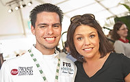 FIU-WF09-033999 - Rachael Ray, right, is among hundreds of chefs gathered together for Florida International University School of Hospitality's annual fundraiser South Beach Wine and Food Festival to raise money for student scholarships Saturday, February, 21, 2009 at SBWF in Miami Beach, Fl. At left is FIU student chef Andres Villabona who assisted Ray at the Grand Tasting Village.