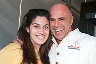 FIU-0543-WF105677 - The Modern Mixologist Tony Abou-Ganim with FIU School of Hopitality student Anna Alonzo at the Grand Tasting village of the 2010 South Beach Wine and Food Festival.