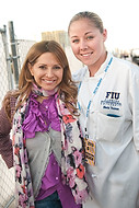 FIU-0545-WF105715 - Miami celebrity chef Ingrid Hoffman, left, with FIU School of Hospitality student Meris Thomas at the Grand Tasting village of the 2010 South Beach Wine and Food Festival.