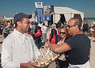 FIU-640-WF105234 - FIU School of Hospitality students/staff at or near FIU SOH booth at the Grand Tasting Village of the 2010 South Beach Wine & Food Festival