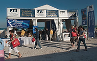 FIU-681-WF105591 - Guests walking by FIU SOH booth at the Grand Tasting Village of the 2010 South Beach Wine & Food Festival