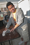 FIU-690-WF105668 - FIU School of Hospitality student doing the dishes at the Grand Tasting Village of the 2010 South Beach Wine & Food Festival
