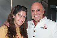 FIU-691-WF105672 - The Modern Mixologist Tony Abou-Ganim with FIU School of Hopitality student Anna Alonzo at the Grand Tasting village of the 2010 South Beach Wine and Food Festival.