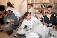 FIU-698-WF105748 - FIU School of Hospitality students in the kitchen at the Grand Tasting Village of the 2010 South Beach Wine & Food Festival