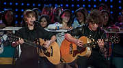 009-PepsiFanJam-5935 - Justin Bieber, left, performs at Pepsi Super Bowl Fan Jam on the beach near Ocean Drive in Miami Beach Feb 4, 2010.  