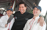 FIU-0216-WF10 - Celebrity Chef Rocco DiSpirito and FIU School of Hospitality student volunteers Julia Piazza and Camilo Patino at the Burger Bash at the 2010 South Beach Wine & Food Festival