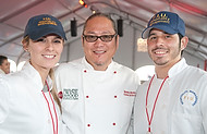 FIU-0219-WF10 - Celebrity Chef Morimoto and FIU School of Hospitality student volunteers Gisele Roach and Erving Blanco at the Burger Bash at the 2010 South Beach Wine & Food Festival