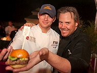 FIU-0245-WF10 - Amstel Light celebrity Chef Jake Linzinmeir of the X Cafe, right, from Telluride, Colorado and FIU School of Hospitality volunteer Alex Lipin at the Burger Bash at the 2010 South Beach Wine & Food Festival