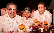 FIU-0247-WF10 - Porter House New York, celebrity Chef Michael LaMonica, left, and and his chef de cuisine, Michael Ammirati, right with FIU School of Hospitality student volunteer Syi Sun. at the Burger Bash at the 2010 South Beach Wine & Food Festival