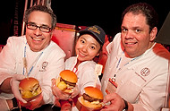 FIU-0248-WF10 - Porter House New York, celebrity Chef Michael LaMonica, left, and and his chef de cuisine, Michael Ammirati, right with FIU School of Hospitality student volunteer Syi Sun. at the Burger Bash at the 2010 South Beach Wine & Food Festival