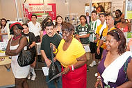 56-TMobileElPibe<br>Doris Byrd, center(yellow), and Nubia Miranda, at right.